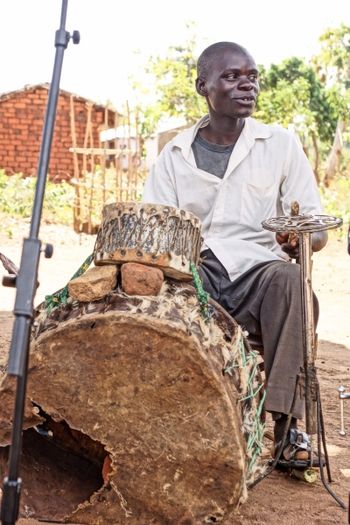 Muligo from the Malawi Mouse Boys playing his homemade drums
