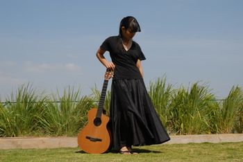 On the riverside with my preferred guitar, a Taylor acoustic-electric
