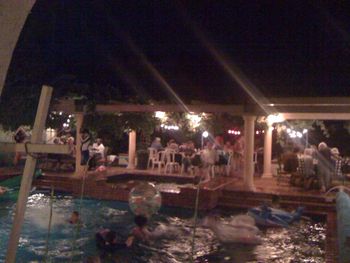 African party pool at night
