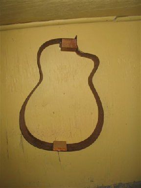 Guitar sides hanging on wall
