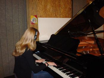 The new studio is still getting some finishing touches, but check out that beautiful piano!
