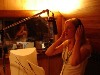 Tara recording some vocals in the studio
