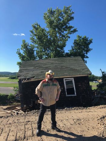 Grayson in front of "dirt house", July 7, 2018, Danbury, CT. This odd deserted house on top of "dirt for sale" fascinated Grayson for years, so he climbed up to it, with the the blessing oif the dirt seller guy. He's glad he did because now, in 2021, that dirt house is gone.
