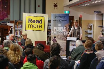 Robin speaks to the crowd at Moreland Library
