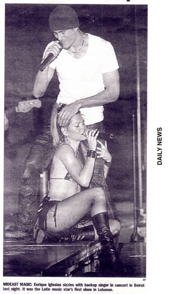 Enrique in lebanon I remeber this show so well - no air conditioning! about 110 degrees on stage under the lights - thus the skimpy outfit! of course THIS was the shot of all nights to make the paper...
