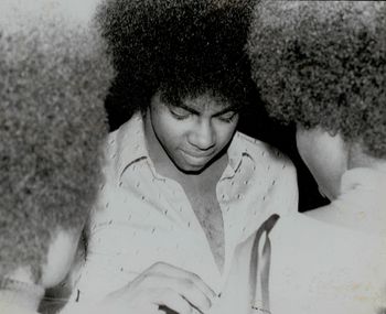 Russell signing an autograph
