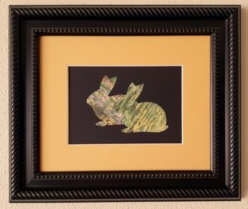 Two Bunnies in Green and Gold. Calendar clippings and non-toxic glue on matboard in black frame, behind glass. 11 1/2"  x 13 1/2" in frame. 2023. SOLD
