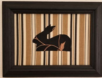 Bunny, Black & Gold. Fabric samples and non-toxic glue on hardboard. 9 1/2" x 12 1/2" in black wood frame. 2019. $60
