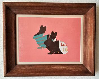 Star Bunnies. Acrylics, calendar clippings, non-toxic glue, and gloss varnish on hardboard in brown wood frame. 10 3/4" x 12 3/4" in frame. 2023. $45
