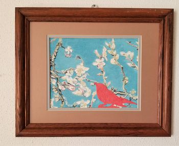 Red Bird in Van Gogh’s Almond Blossoms. Wallpaper samples, non-toxic glue, and gloss varnish on hardboard in brown wood frame. 13 1/2" x 16 1/2" in frame. 2021. $45
