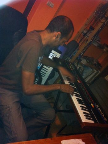 In the studio Mehdi on the Juno-6
