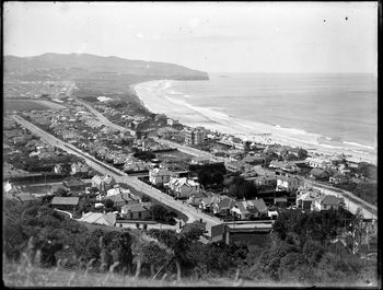 Looking along St Clair beach, Dunedin with Forbury Park (far left) 1930
