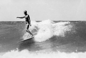 Ross Edge Waipu Cove (Northland)......This is a great photo of those early days Ross was a very smooth surfer! Notice how early he managed to catch the wave...and who could forget those trademark shorts...looks like quite a thin board too..sharpish rails!.....one of our earliest Northland surfing pioneers!!
