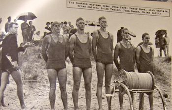 A rainy summers day in '63...The opening of the new Ruakaka SLSC clubhouse.... Peter Howe on the left..an Aussie transplant..& Tatahi boardrider Johnny Bruce becomes Ruakaka SLSC club Capt. in '66..& Brick Taylor (middle) taught me to stand up on a surfski in 1959....there was very little conflict between the clubby & surfers in '63
