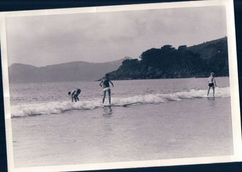 Waipu Cove summer of '63 The lovable 'Billy Prichard' having fun on a 6" wave...Peter Delarue going the wrong way!!! Billy was probably the first person that i ever saw wearing a kind-of wetsuit vest..was very loose and sloppy with no sleeves i remember!!
