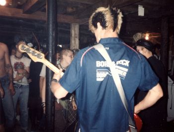 Bastard Squad (Detroit) live W/ Civil Disobedience @ the T.A.C., June 14th, 1992. In the foreground on the bass guitar is Nosferatu Smith, prior to his tenure with Civil D playing rhythm guitar, which began in June of 1994
