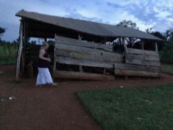 Robin praying around RGW Church in Jinja Weak in structure...strong in faith.
