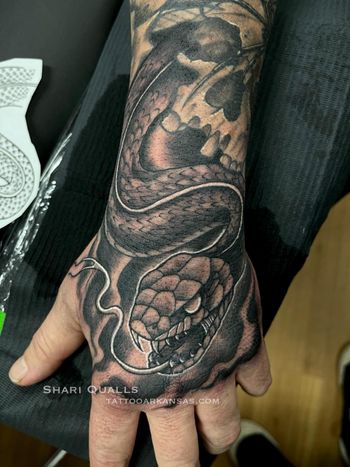Black and Grey Snake on Hand by Shari Qualls at Lucky Bella Tattoos in North Little Rock
