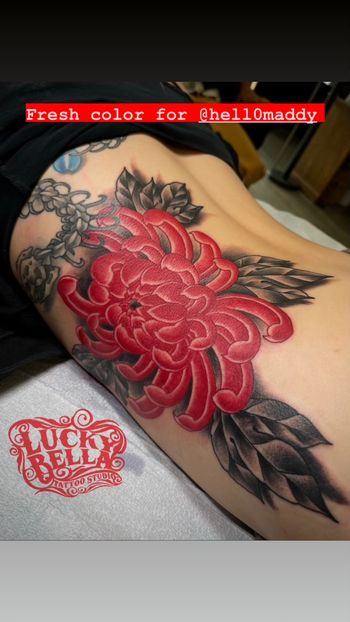 Red chrysanthemum tattoo by Howard Neal
