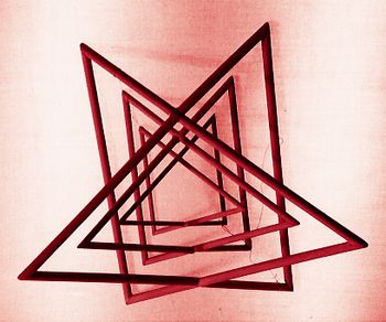 Nesting 3 pairs of triangles made of wood Designs for Enlightenment © Carmela Tal Baron 1988
