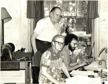 A classic photo Mark Cohen, typing Sis Cunningham's autobiographical notes, with Gordon Friesen, standing.  Sis was one of the Almanac Singers, and, with her husband Gordon, founded Broadside Magazine and first published the songs of so many of us, their door always open
