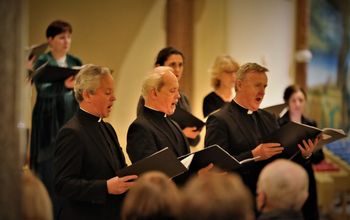 Cappella founder members Fr Martin O'Hagan, Fr Eugene O'Hagan and Fr David Delargy sing during the Renewed in Song concert to mark Donal McCrisken's retirement. Photograph - Vincent McLaughlin
