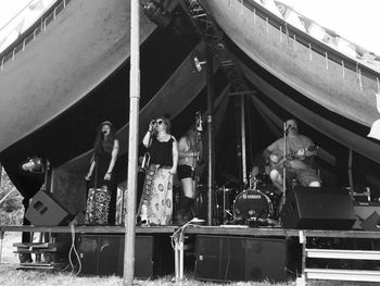 Cinematic sounds - On stage with Dr Zod at Friend Festival. Also seen in this photo are Lisa Martin, left; Cherry Scott, behind centre, and Roy Storey, far right, with Kelly singing in the middle. There are more Zods & Zodettes out of shot. Photo by Jen Thomas
