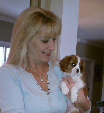 Christine saying goodbye to a Promontory puppy before the baby goes to his forever home.
