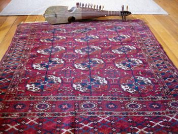 Afghan rubab and 19th-c. Tekke rug
