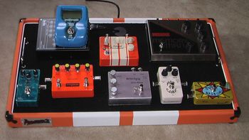 Current board set up. Bottom (L to R): BJF SBEQ, Empress Tremelo, Calypso Whirligig, Crowther Bluesberry, ZVex SHO. Top (L to R): Juicebox 3.0 Power Supply, Peterson StroboStomp tuner, Pedal Doctor 4 Speed OD, Analogman Mod EH DLX Memory Man. The pedal board itself is a custom made Pumaboard.
