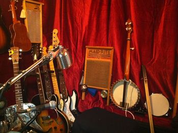 a bunch of different guitars and washboards in my music room.

