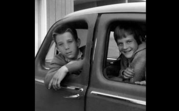 Greg and Beverly in mom's first car "The Austin. "
