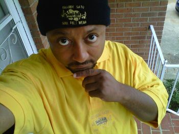 J.O.T. aka GRANDE GATO wearing yellow SOUL-FULL wear polo styled shirt.
