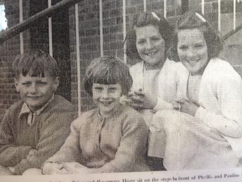 Some Brownlee children sittiing on the back steps in 1965

