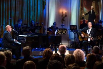 Performing at the White House with Billy Joel and James Taylor. President Obama listens closely.
