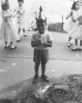 Me holding court with all Joyce's friends at her first communion. Philly, Pa.  The almighty Tootsie-Pop.

