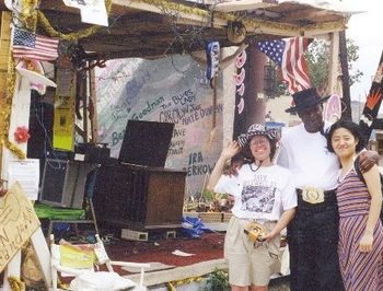 Maxwell St. stage before the Fall, 2000, with bluesman Jimmy Lee Robinson and Japanese filmmaker
