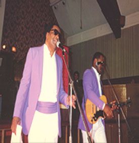 Clarence Fountain & Sam Butler Jr. performing on stage

