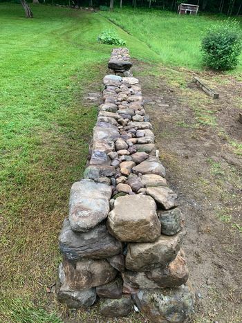 4' stone wall with stone harvested from the property
