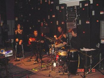 The Gajate Quartet playing a clinic for Presonus Audio at Guitar Center Hollywood. Left to right: singer Margo Reymundo, guitarist Marco Tulio, bassist Guillermo Guzman and percussionist Richie "Gajat