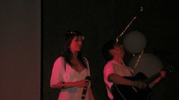 Angelina and Edward singing in Palm Springs.

