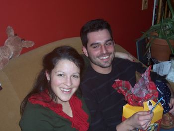 Meggan and Andrew open a gift
