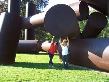 Niece Meggan and sister-in-law Mary Ellen "hold up" this huge sculpture
