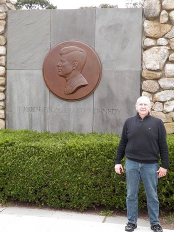 Joe in front of the giant JFK medallion
