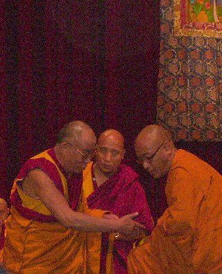 The Dalai Lama, on left
