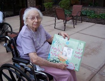 Mom with photo album of memories - day 4 of visit
