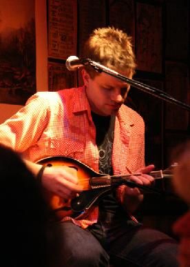 20 minutes to tune, 2 minutes to go out of tune. Andrew playin' the mandolin at Godfreys, 2/23/07. Photo by Joe Ledva.
