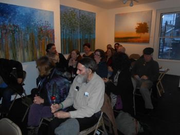Our jovial audience at Outpost 186 on 1/18/14 — Busted! John checks his iPhone. (photo: Karen Welling)
