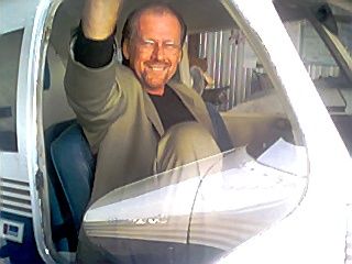 Grenada, MS--Tom loves checking out Pastor Bullion's plane. Tom almost had his pilot license...almost....
