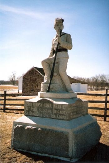 The 149th Pennsylvania's monument sits alongside Route 30 just west of Gettysburg.  Note McPherson's barn in the background.
